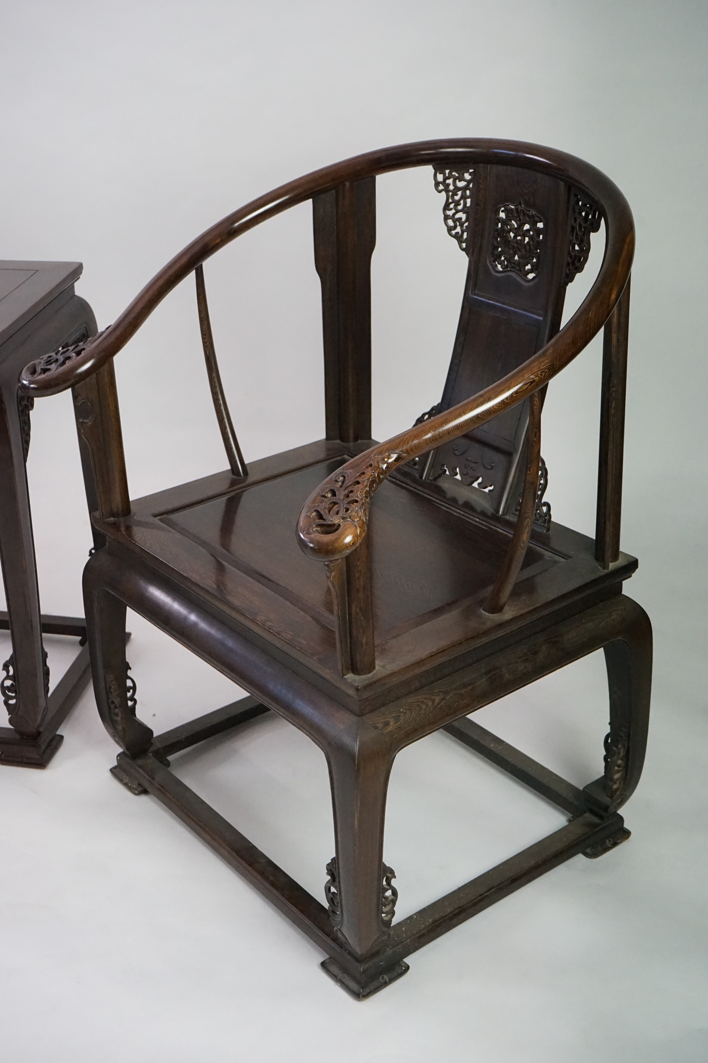 A pair of Chinese jichimu horseshoe shaped armchairs and a matching table, 19th/20th century